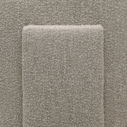 Close-up of a textured taupe fabric detailing on back of armchair 