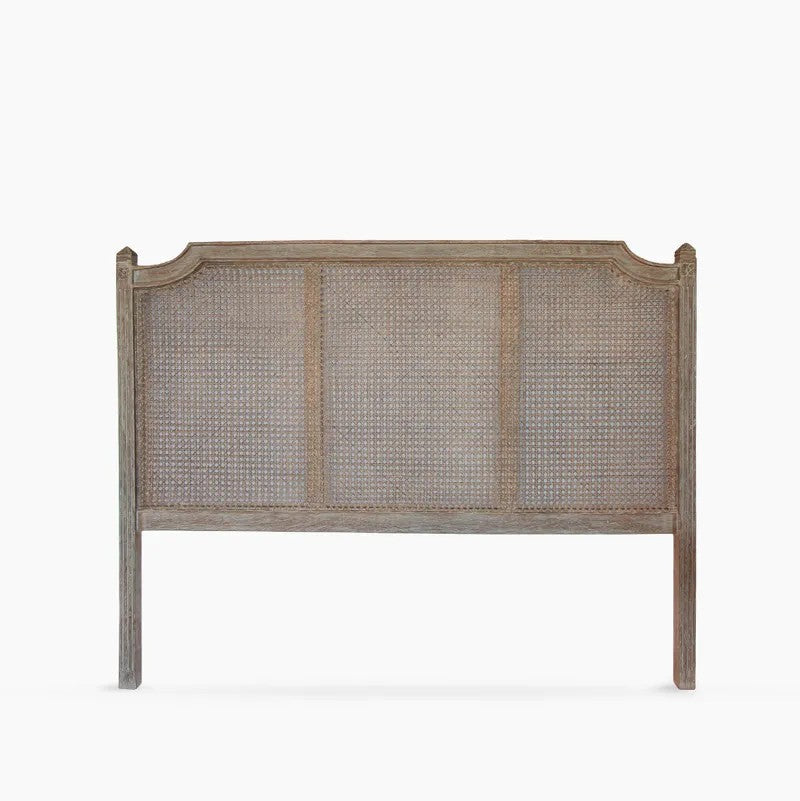A rustic style wooden headboard with a weathered grey-wash finish and woven cane panels, shown against a plain white background.