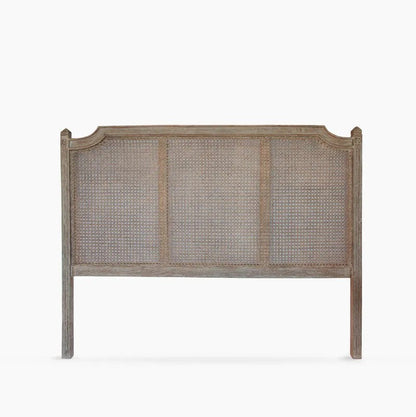 A rustic style wooden headboard with a weathered grey-wash finish and woven cane panels, shown against a plain white background.
