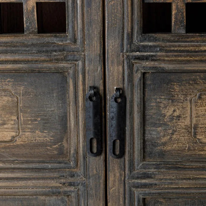 Close-up of Nomad Cabinet wooden doors with metal handles