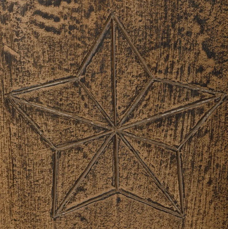 Star-shaped design on a textured brown surface of Nomad Cabinet