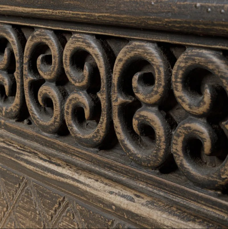 Close-up of ornate carved detailing with intricate patterns on the Nomad Low Cabinet 