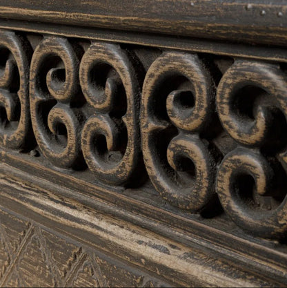 Close-up of ornate carved detailing with intricate patterns on the Nomad Low Cabinet 