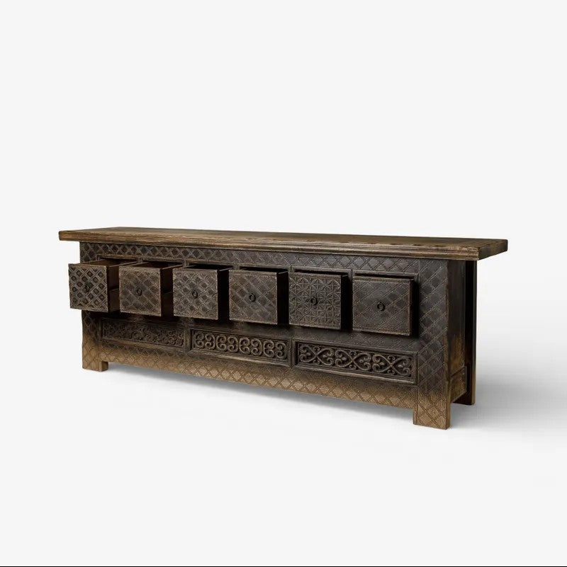 Low wooden Nomad Cabinet with drawers open on a white background