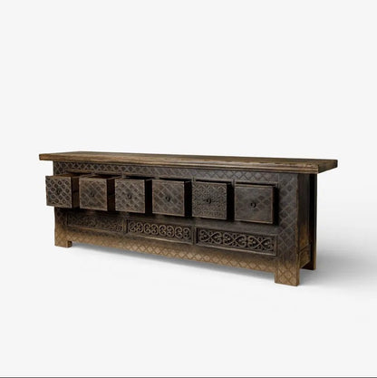 Low wooden Nomad Cabinet with drawers open on a white background