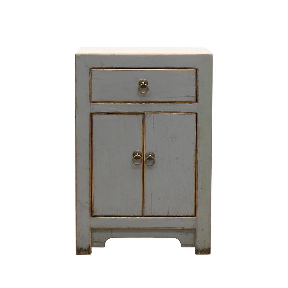 Small grey wooden bedside cabinet with a single drawer and two doors on a white background