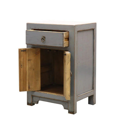 Small wooden cabinet with a grey painted finish and open door on a white background