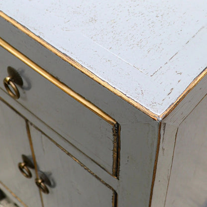 Close-up of a grey painted bedside cabinet 