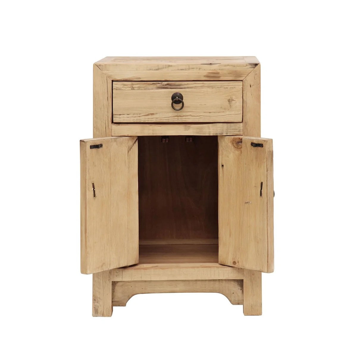 A small rustic wooden bedside cabinet with a single drawer on top and two doors swung open, showing an open shelf inside. The cabinet is made of light natural wood with visible grain and knots, featuring dark metal hardware.