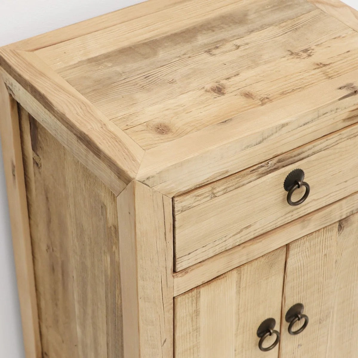 Wooden bedside cabinet with a drawer and two doors on a light white background