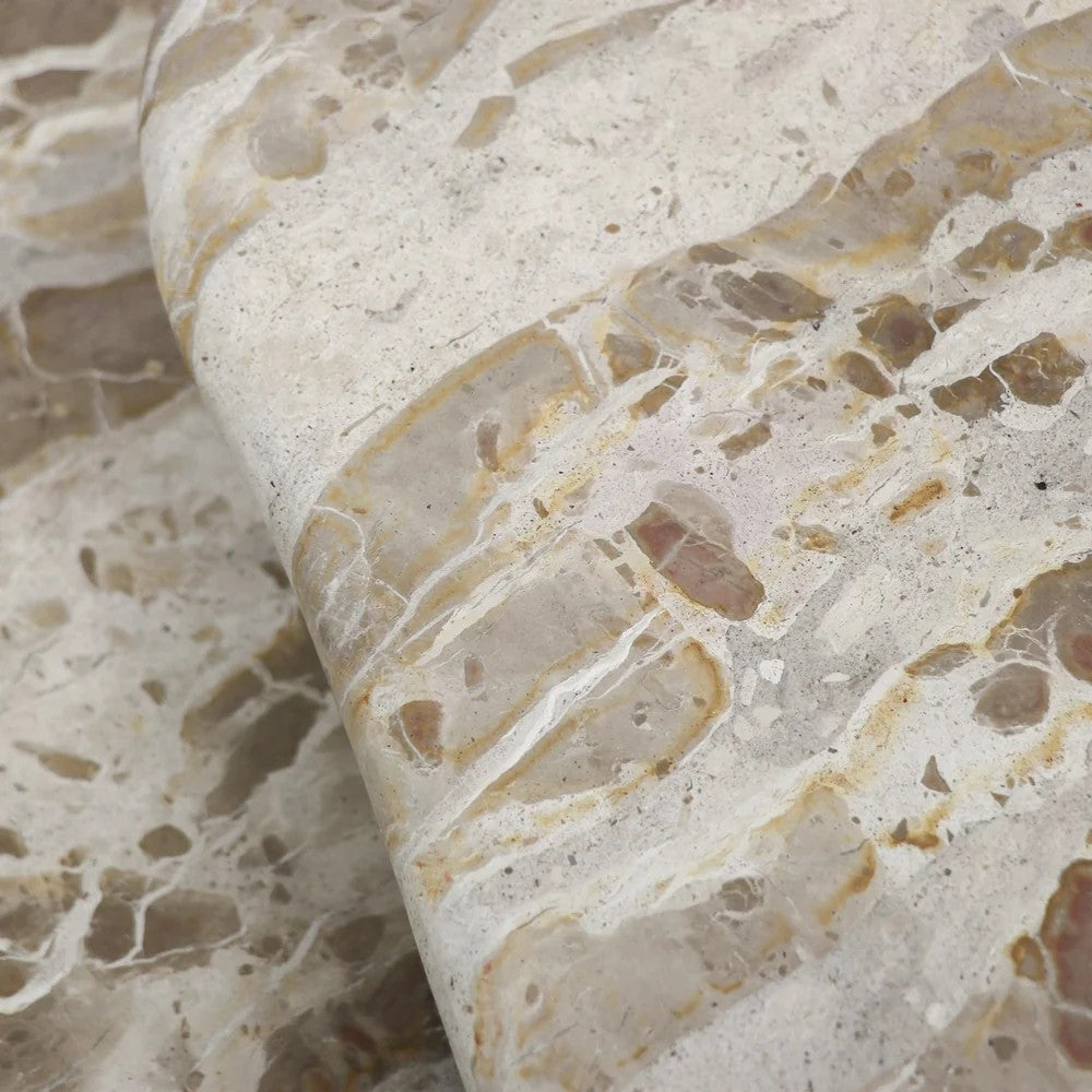 Close-up of panther beige marble table tops with beige and brown marbled pattern