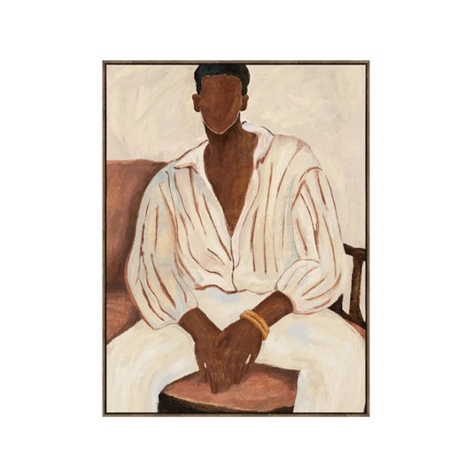 A framed painting depicting a seated figure with a dark brown face and hands, wearing a loose white shirt and white pants, with brown chair elements in the background.