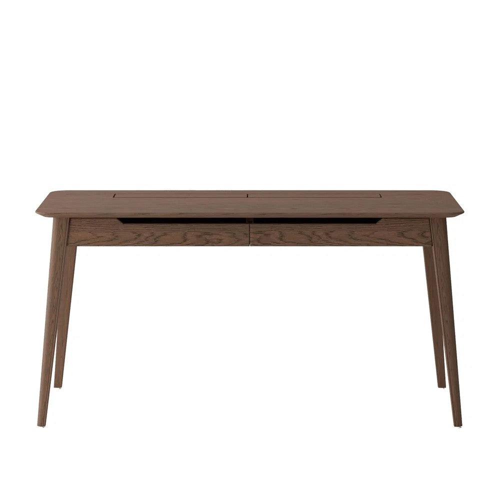 A mid-century modern wooden desk with a dark walnut finish, featuring tapered legs and a recessed drawer front, shown against a plain white background.