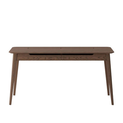 A mid-century modern wooden desk with a dark walnut finish, featuring tapered legs and a recessed drawer front, shown against a plain white background.