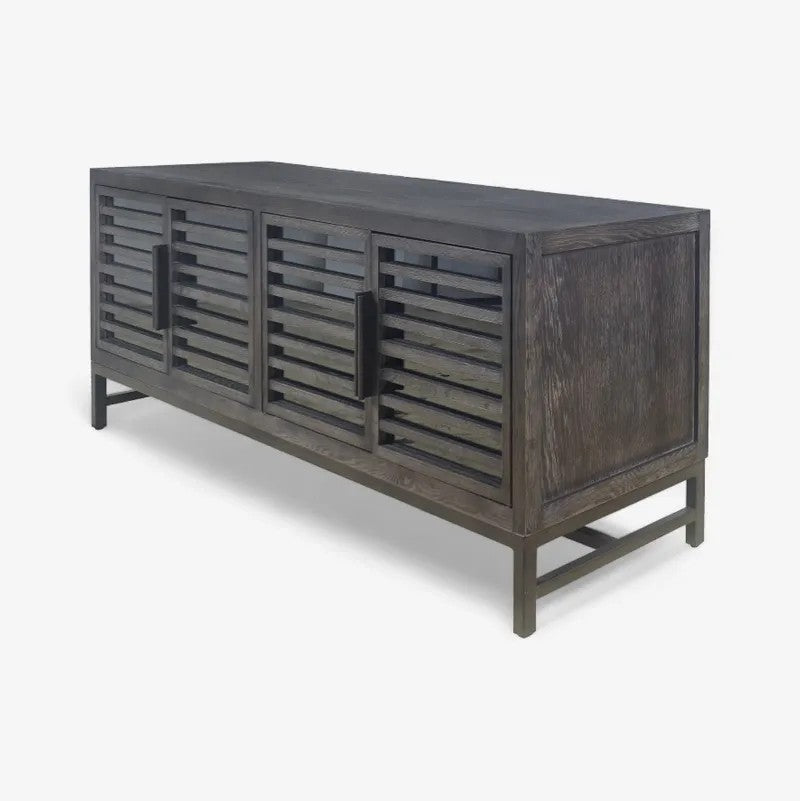 A dark grey wood cabinet with slatted doors and a low profile, shown on a white background.