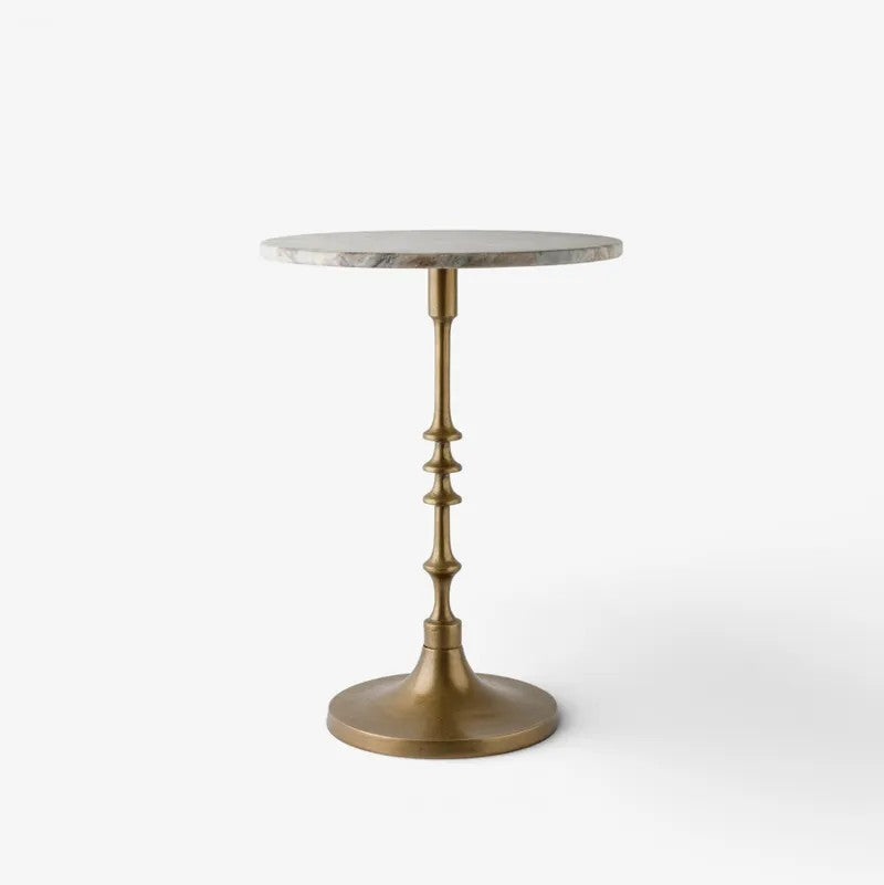 A round side table with a light gray marble top and a decorative antique brass pedestal base, shown against a plain white background.