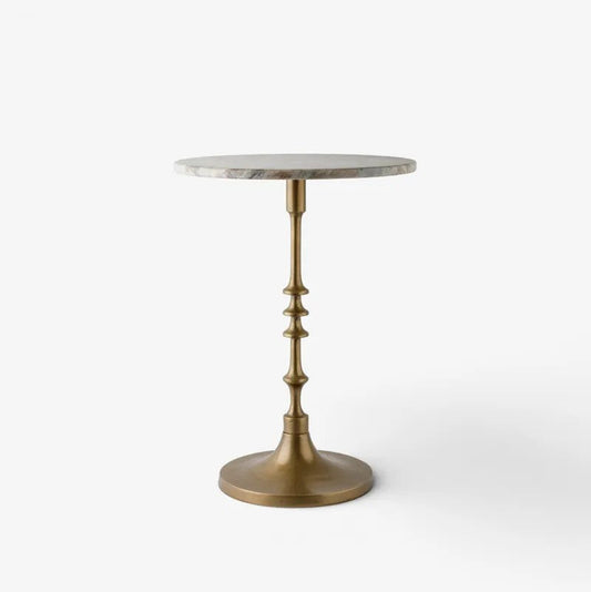 A round side table with a light gray marble top and a decorative antique brass pedestal base, shown against a plain white background.