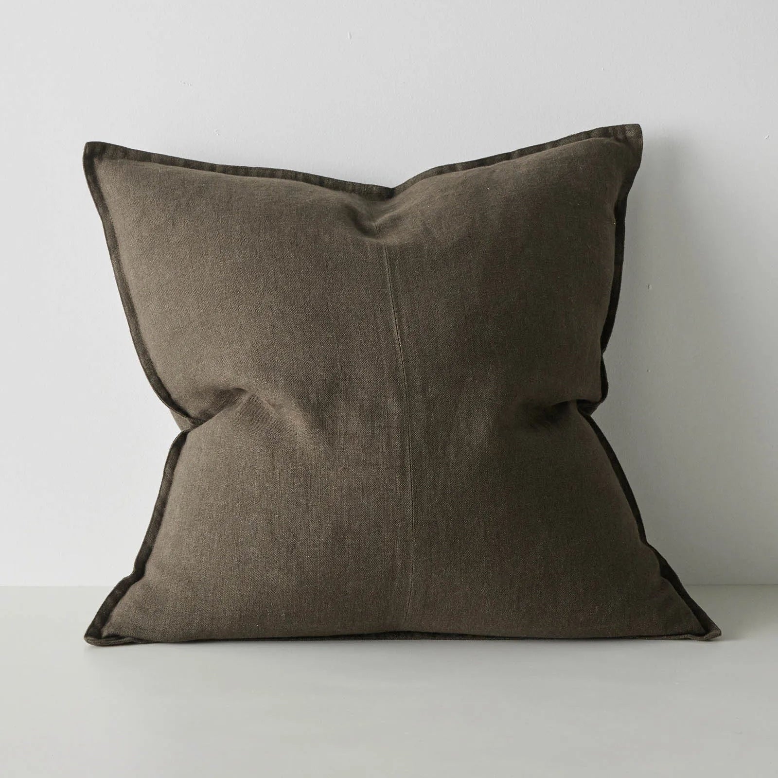 Brown pillow on a light gray background