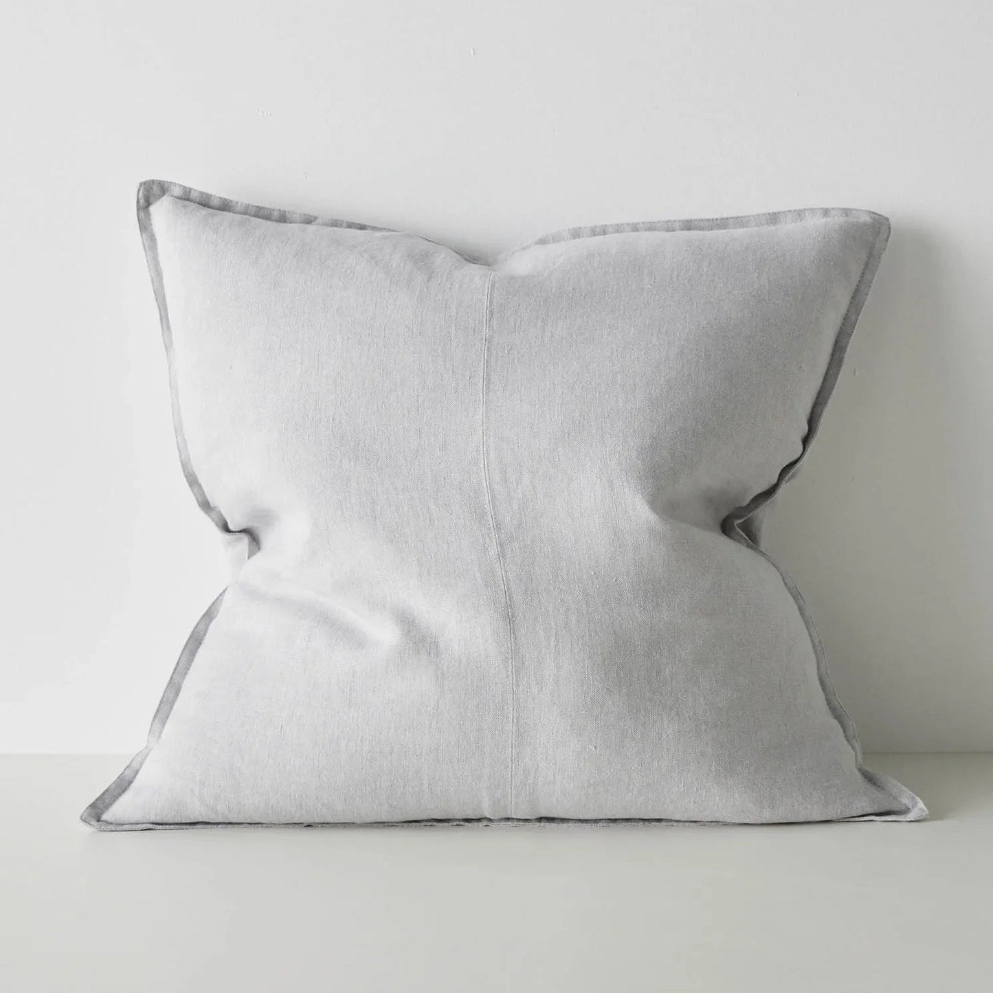 Light grey cushion on a light grey background