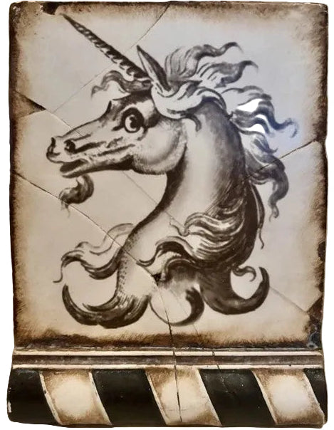 Decorative tile with a unicorn design on a textured background