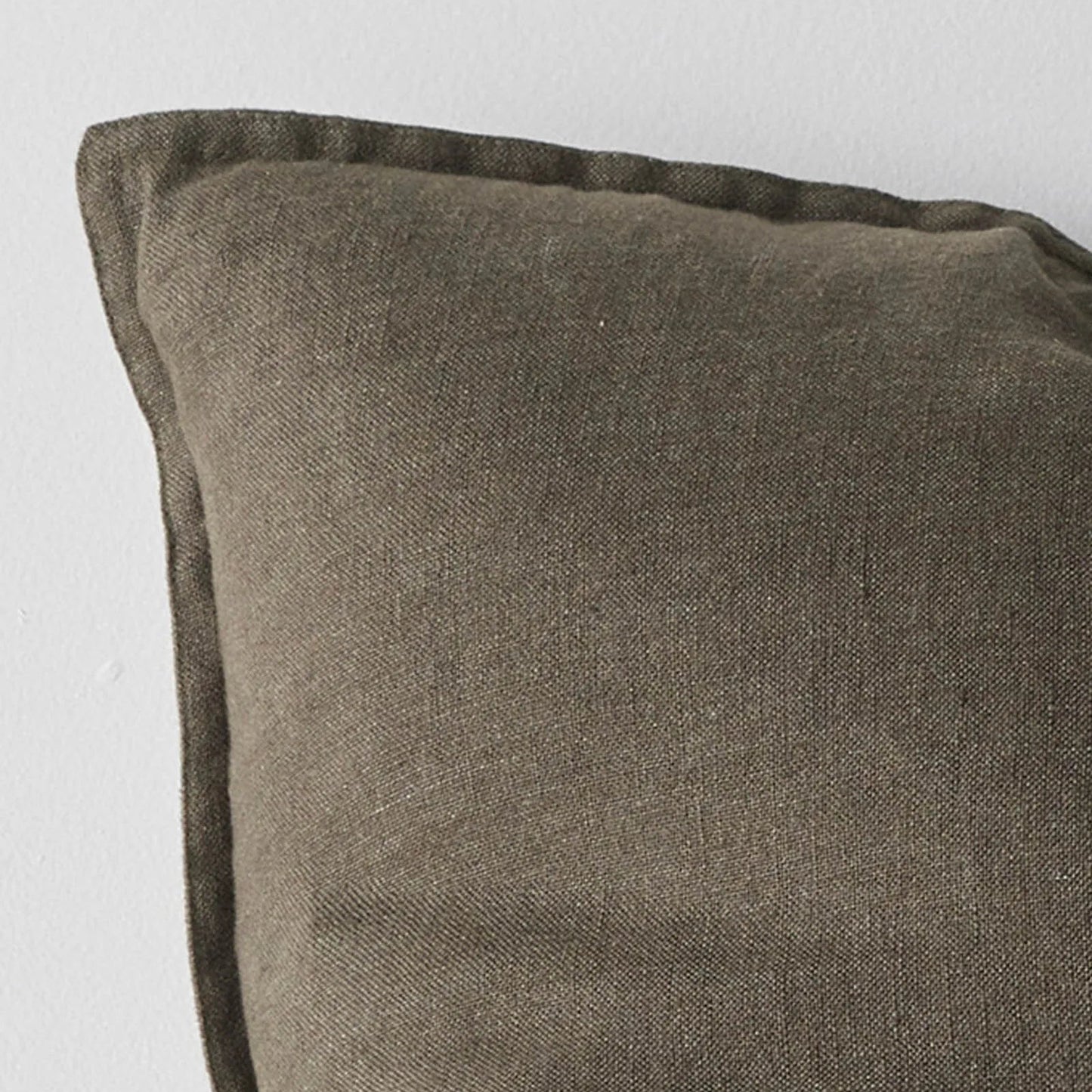 Brown textured pillow on a light gray background
